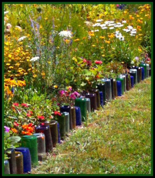 Use glass bottles to edge your garden path.