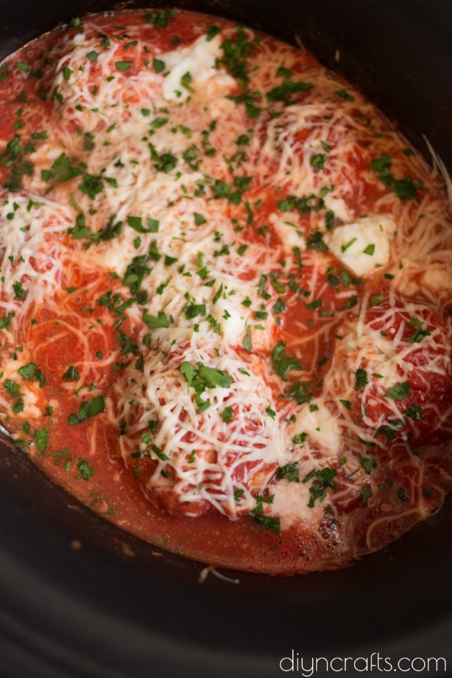 Adding cheese and parsley.